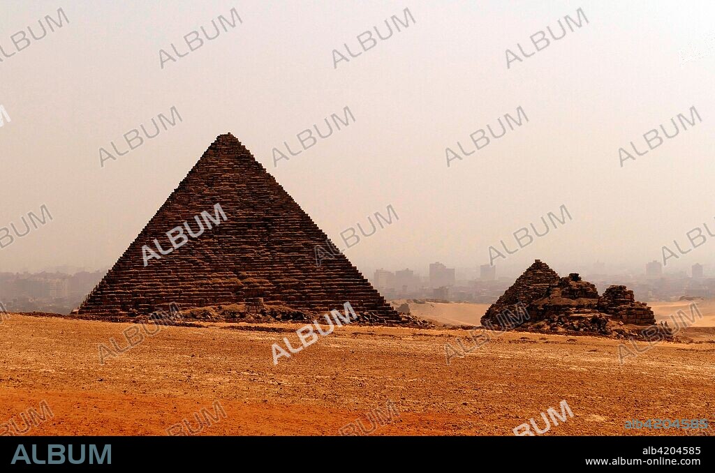 The Pyramid of Menkaure. on the Giza Plateau. Cairo. Egypt. is the smallest of the three main Pyramids of Giza. It is thought to have been built to serve as the tomb of the fourth dynasty. Egyptian Pharaoh Menkaure. approx. 2500 BC. South of the pyramid of Menkaure are three satellite pyramids that are each accompanied with a temple and have a substructure.