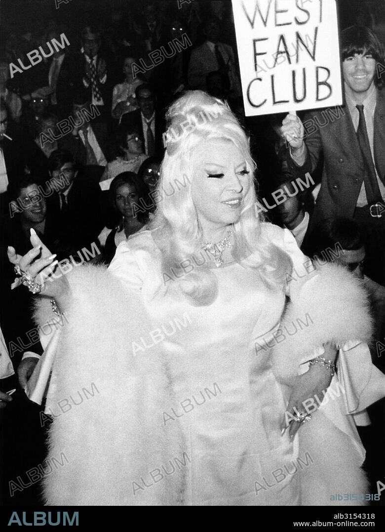 New York, New York:  June 23, 1970 Actress Mae West greets the crowd of 10,000 fans who gathered to see her as she attended the premiere showing of the film, 'Myra Breckinridge' at the Criterion Theater.