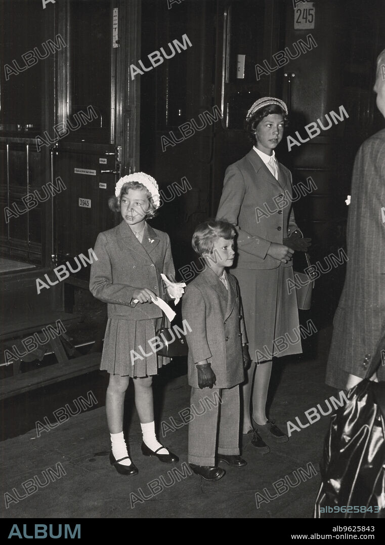 Crown Prince Carl Gustaf of Sweden and his sisters, 2 September 1952. Returning to Stockholm from their summer residence at Solliden, Öland. Princess Desiree (1938-), Princess Christina (1943-) and Crown Prince Carl Gustaf (1946-), the three youngest children of Prince Gustaf Adolf, Duke of Västerbotten and Princess Sibylla of Saxe-Coburg and Gotha. The Crown Prince came to the throne as King Carl XVI Gustaf in 1973. From the collection of Svenskt Fotoreportages.