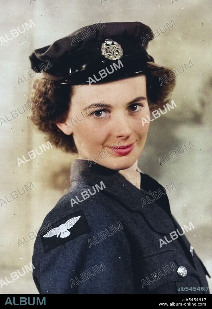 The W.A.A.F. Poster Girl - Miss Elizabeth Harvey photographed in W.A.A.F. uniform wearing hat. The W.A.A.F. Poster Girl is Elizabeth Harvey, who lives at ***** Latmore Avenue, Claygate, Surrey. She was chosen a week ago from six semi-finalists at a meeting which took place at the Air Ministry Whitehall, where the judges were Mr. William Dring, A.R.A., Air Chief Commandant Lady Welsh, Director of W.A.A.F., and Air Chief Marshal Sir Phillip Joubert de la Perte, K.C.B., C.I.C., D.S.O. Miss Harvey, who is tall and slim, is at present working for the Control Commission at Lubbeoke, Germany, was born in 1923 and was educated at St. Stephons College, Folkestone and Hillside Covont College, Farnborough, Kent. October 1, 1946. (Photo by British Official Photograph).