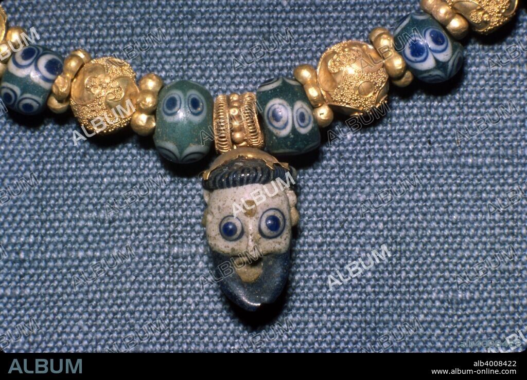 Phoenician glass head on Etruscan Necklace, c7th century BC. The Etruscan civilization is the modern name given to a powerful and wealthy civilization of ancient Italy in the area corresponding roughly to Tuscany, western Umbria, and northern Lazio.