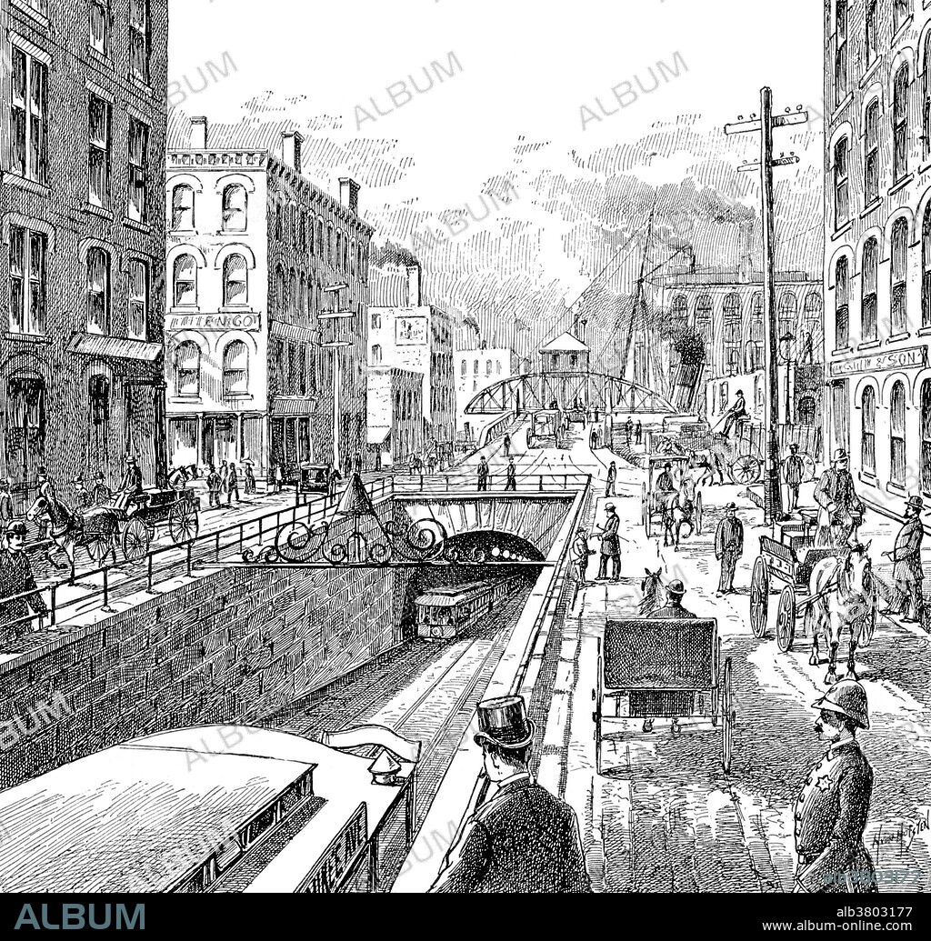 The Washington Street Tunnel was the first traffic tunnel under the Chicago River. J.L. Lake was awarded the contract to construct the tunnel in 1867 and its construction was completed in 1869. This tunnel was 1605 feet long, from Franklin Street west to Clinton Street, and cost $517,000. By 1884 it was leaking and had to be closed. In 1888 the West Chicago Street Railroad leased the tunnel. Construction began in 1888 and the tunnel was reopened August 12, 1890. The reversing of the Chicago River in 1900 lowered the water level and exposed the roof of the tunnel in the riverbed. Several ships ran aground on it, damaging the roof. In 1904 the Federal government declared it a hazard to navigation, it was closed in 1906. A wider, deeper concrete replacement was built under the original masonry. The approaches were deepened to a new lower tunnel level. The tunnel reopened for electric streetcar service on January 29, 1911 and was in use until the end of streetcar service 1953.