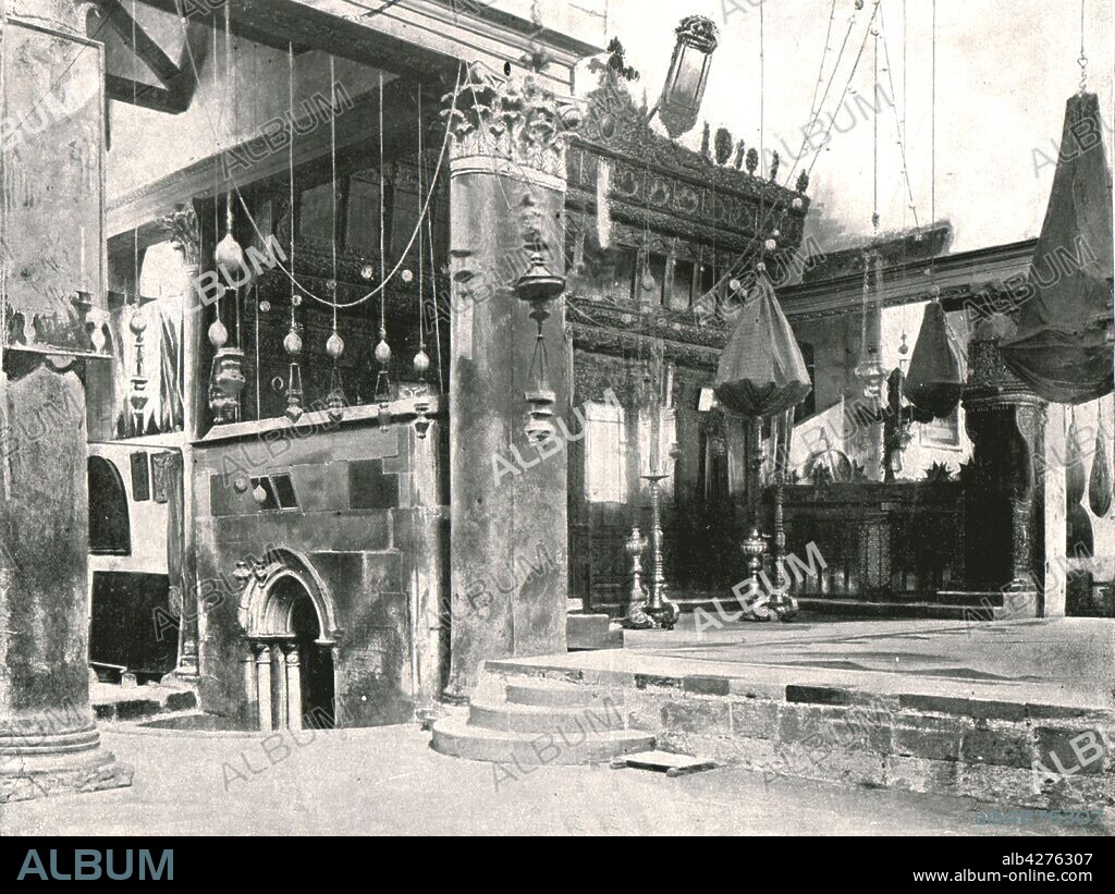 Interior of the Church of the Nativity, Bethlehem, Palestine, 1895. The grotto inside the church is believed by Christians to have been the birthplace of Jesus. Commissioned in 327 AD by Constantine the Great, it is the oldest site continuously used as a place of worship in Christianity. From "Round the World in Pictures and Photographs: From London Bridge to Charing Cross via Yokohama and Chicago". [George Newnes Ltd, London, 1895].