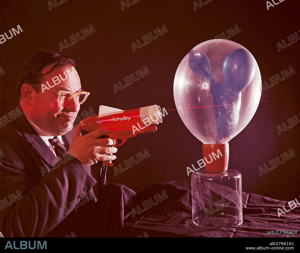 Dr Schawlow of Stanford with laser ray gun. Schawlow is the co-inventor of the laser.