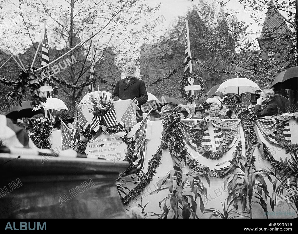 HARRIS & EWING. Longfellow Statue, Speaking - Major General Adolphus Washington Greeley, U.S.A., 1909. [US Army officer and polar explorer Adolphus Greely giving a speech at the unveiling of the Henry Wadsworth Longfellow Memorial in Washington D.C. The bronze statue was designed by William Couper and Thomas Ball. On the dais, decorated with flags and greenery, is a plaque with lines from 'The Ship of State', one of Longfellow's poems: 'Thou, too, sail on, O Ship of State! Sail on, O UNION, strong and great! Humanity with all its fears, With all the hopes of future years, Is hanging breathless on thy fate!'].