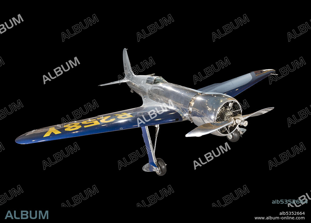 HUGHES AIRCRAFT CO. and GLENN ODEKIRK. Experimental, single engine, monoplane for air racing; wood wings with blue paint; yellow markings; bare aluminum fuselage. The Hughes H-1 racer, designed by Howard Hughes and Richard Palmer and built by Glenn Odekirk, was developed to be the fastest landplane in the world. On September 13, 1935, Hughes achieved this design goal by flying the H-1 to a new world speed record of 567 kilometers (352 miles) per hour at Santa Ana, California. Also known as the Hughes 1B, the H-1 was designed with two sets of wings: a short set with a span of 7.6 meters (25 feet) for speed record flight, and a long set with a span of 9.2 meters (31 feet, 9 inches) for transcontinental flight. The aircraft as it is exhibited here is equipped with the long set. Hughes broke the transcontinental U.S. speed record in the H-l on January 19, 1937, flying from Los Angeles to Newark, New Jersey, in 7 hours, 28 minutes, and 25 seconds. His average speed for the 4,000-kilometer (2,490-mile) flight was 535 kilometers (332 miles) per hour.