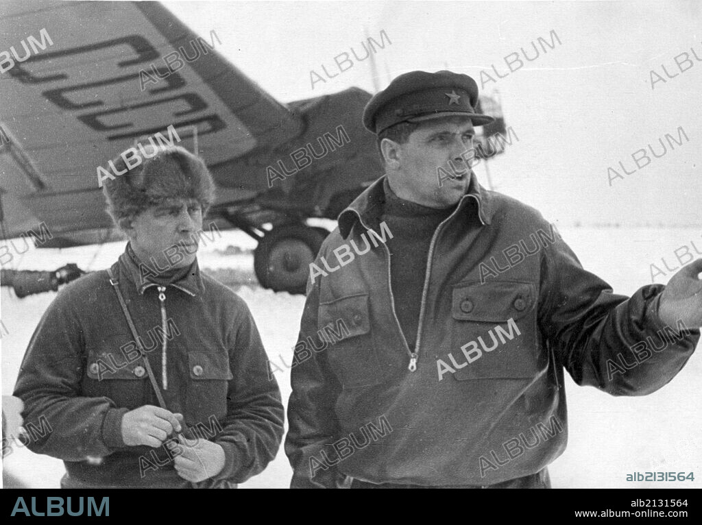 Hero of the soviet union m, v, vodopyanov, commander of the flagship plane ussr n-170, and chief navigator of the expedition maj, i, t, spirin, at the airdrome in kholmogory on the way to rudolf island, (credit: sovfoto / eastfoto) .