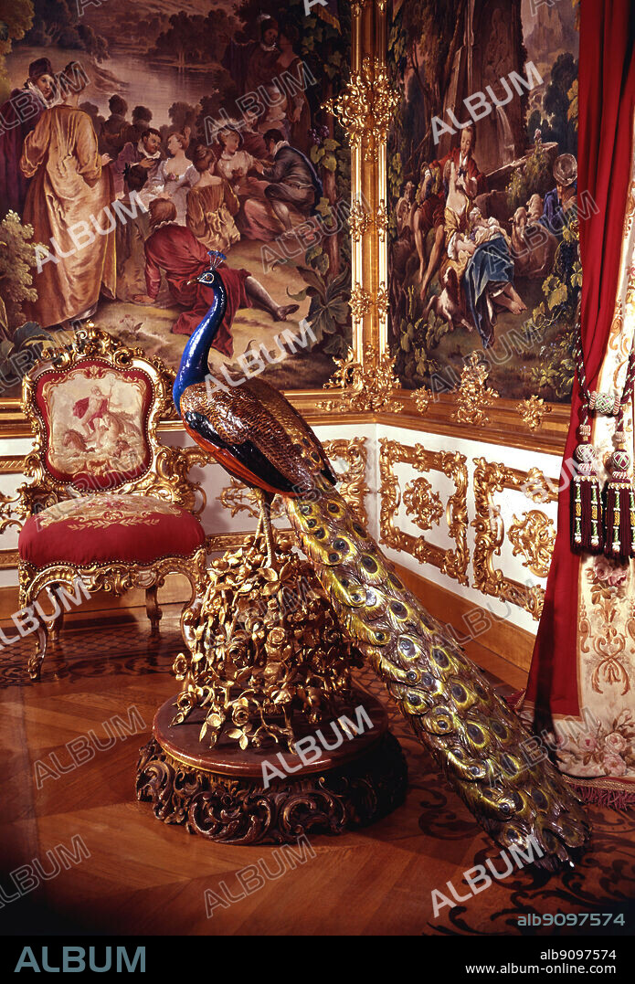 Life size Sevres porcelain peacock in the West Gobelin. Schloss Linderhof, Bavaria, Germany. Also known as the Western Tapestry Chamber or the Music Room. The peacock was commissioned by Ludwig II as a replica of the Petit Trianon at Versailles. ©2006 TopFoto. Sevres Peacock in Gobelins Room (one of a pair). Linderhof, Germany. ©2006 TopFoto.