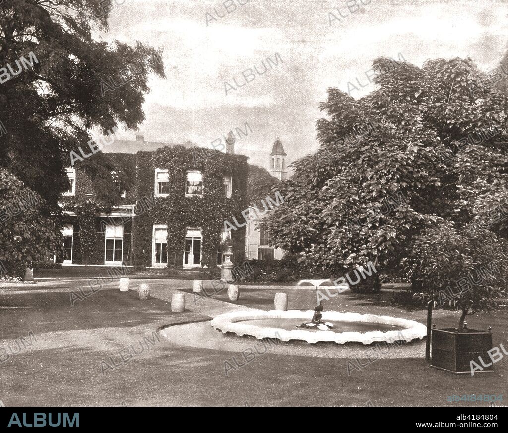 Cambridge Cottage, Kew Green, London, 1894. Residence of Prince George, Duke of Cambridge (1819-1904). The house became part of Kew Gardens in 1904. From Beautiful Britain; views of our stately homes. [The Werner Company of Chicago, 1894].