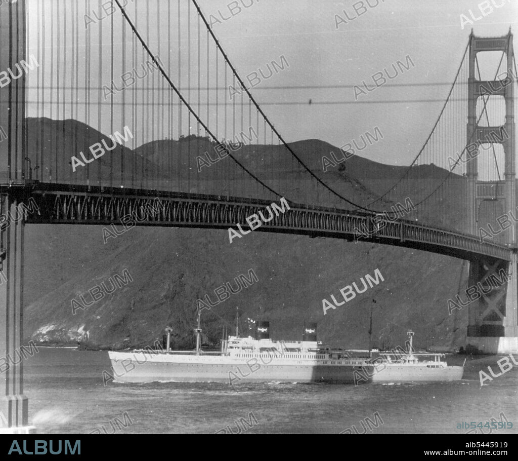 S. S. President Cleveland Heads Seaward For First Trail -- The S.S. President Cleveland, largest passenger vessel ever built on the Pacific Coast, sticks her bow out through the Golden Gate here today and heads seaward for her first day of trials. The Cleveland,her rut by the shadow cast by the Golden Gate Bridge, looks huge. displaces 23,000 tons is 610 feet long carries 550 passengers and a of 340. December 8, 1947. (Photo by AP Wirephoto).
