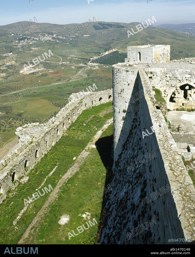 Krak des Chevaliers, Crusader castle. Built by knights Hospitaller (second castle), 1142-1170. View of walls. Syria. Photo before Syrian Civil War.