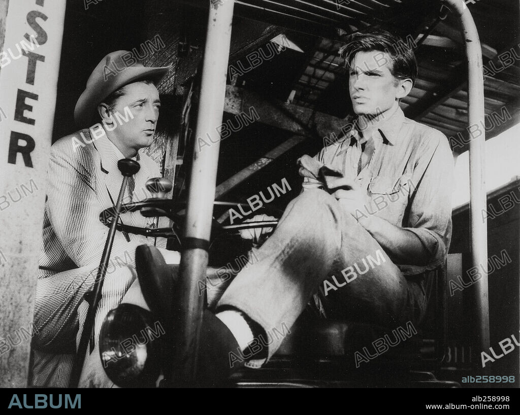 George Hamilton and ROBERT MITCHUM in HOME FROM THE HILL, 1960, directed by VINCENTE MINNELLI. Copyright M.G.M.