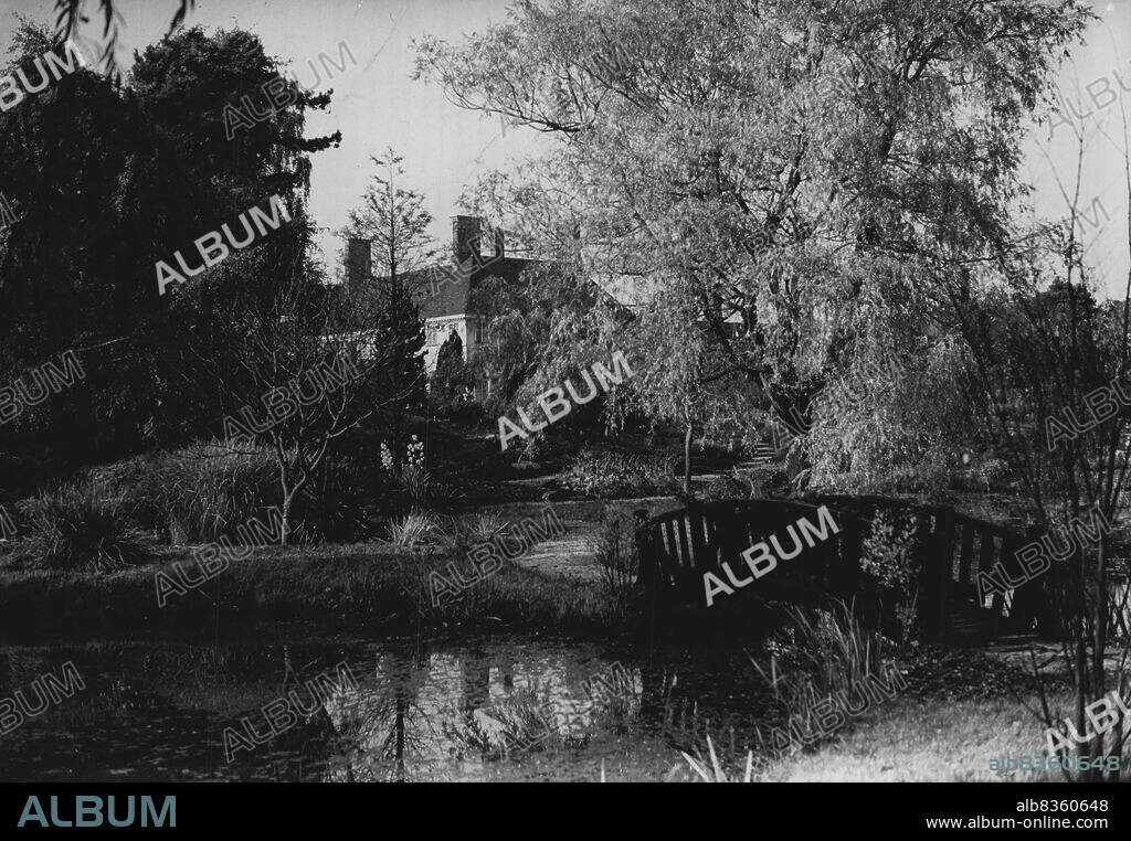 A Likely Home For The Princess -- Windlesham Moor seen across the small lake in the grounds. Autumn tints set off the estate to good advantage when this picture was taken to-day (Saturday). Windlesham Moor, one of Surrey's most beautiful small estates, is suggested as a likely residence for H.R.H Princess Elizabeth after her marriage to Lieut. Philip Mountbatten, R.N. The house, which is the property of Mrs. Warwick Bryant, formerly Mrs. Philip Hill, widow of the millionaire financier, stands in some 50 acres of grounds, noted for their fine rhododendrons and harbaceous borders. The estate was visited last week-end by the Princess and her fiance. October 25, 1947. (Photo by Reuterphoto).