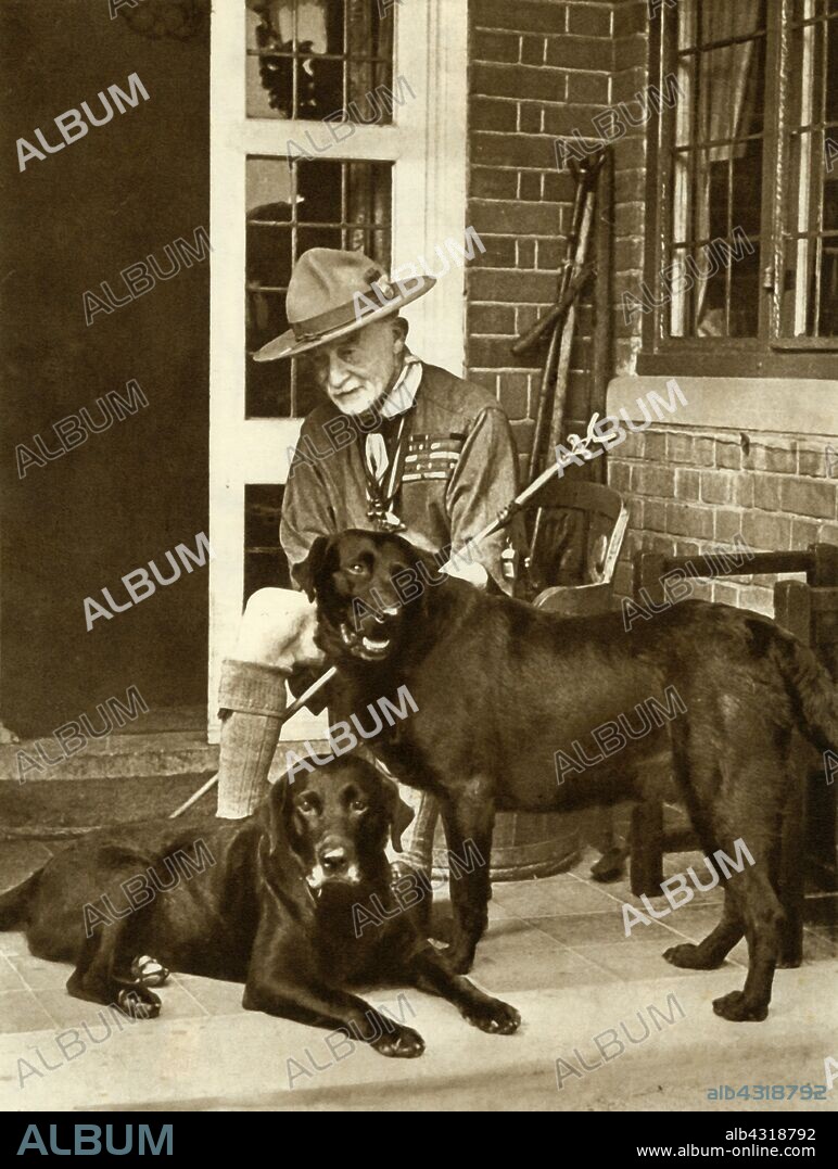 Robert Baden-Powell at home with his dogs, c1929, (1935). English soldier Robert Stephenson Smyth Baden-Powell, 1st Viscount Baden-Powell (1857-1941) became famous as the defender of Mafeking in the Boer War (1899-1902). He later founded the Boy Scouts (1908), Girl Guides (1910) and Wolf Cubs (1916). He is seen here in Scout uniform. From "The Silver Jubilee Book - The Story of 25 Eventful Years in Pictures". [Odhams Press Ltd., London, 1935].