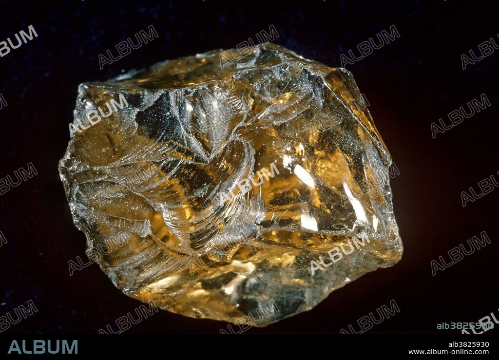 Citrine, a variety of quartz, showing conchoidal fracture.