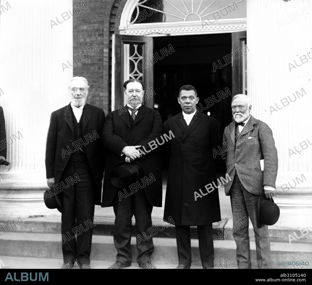Left to right: Robert C. Ogden, Senator William Howard Taft, Booker T. Washington and Andrew Carnegie, standing on the steps of a building, at the Tuskegee Institute's 25th anniversary celebration. Tuskegee University is a private, historically black university located in Tuskegee, Alabama, USA; established by Booker T. Washington.