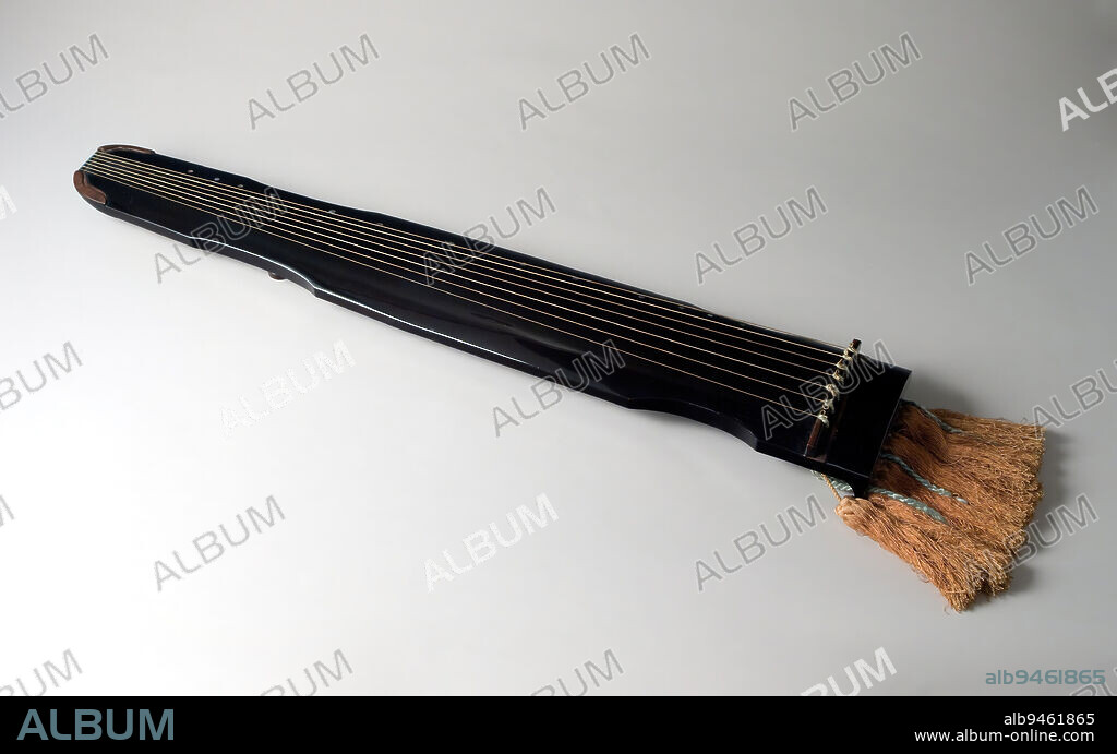 Zither named 'Flowing Water', 1794, Nakamura Stetsu, 3 × 32 3/8 × 5 3/8 in. (7.62 × 82.23 × 13.65 cm), Wood with black lacquer and mother-of-pearl inlay; silk tassels, Japan, 18th century, The seven-stringed zither, called kin in Japanese, has been played in China (where it is called qin) for at least 3,000 years. It was introduced to Japan by the 700s and was a common instrument in the cultural sphere represented in The Tale of Genji. This example of a kin was created by an artist of the celebrated Nakamura family of lacquerers, all of whom used the given name Stetsu. The artist of this zither, which is dated to 1794, was probably the fifth-generation Nakamura Stetsu, who lived from 1764 to 1811. The Nakamura lacquerers maintained relationships with Japans leading cultural trendsetters and were celebrated for their craftsmanship.