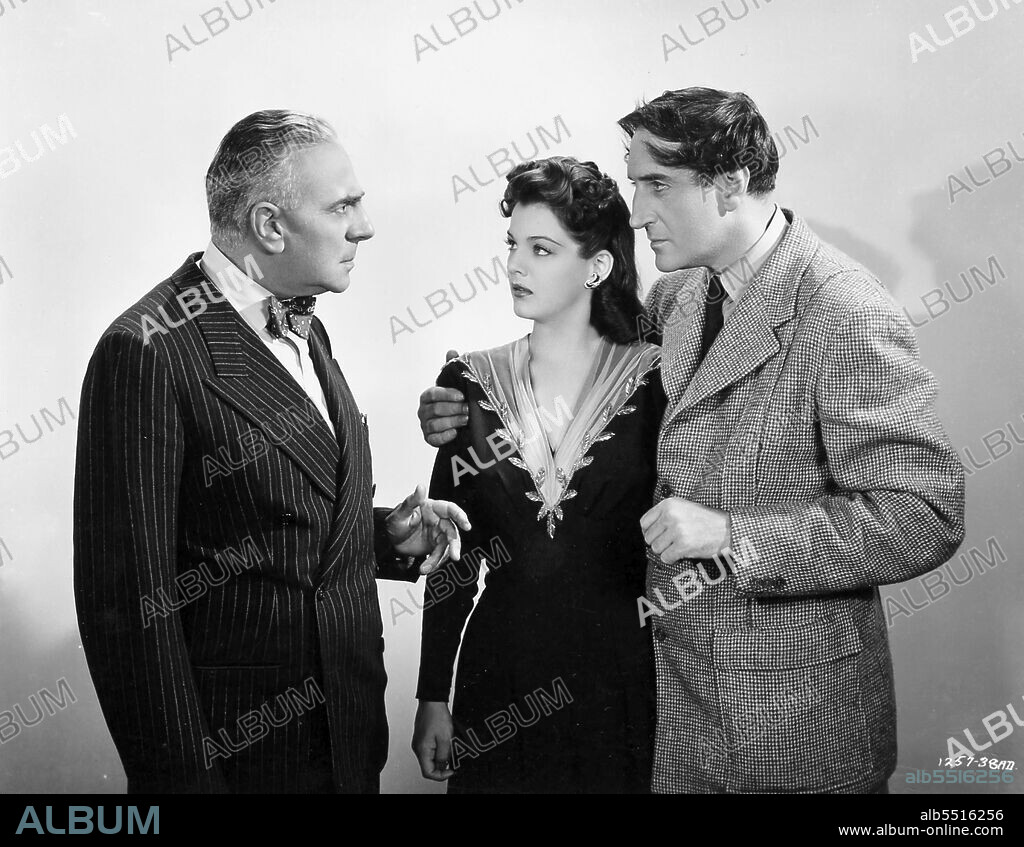 BASIL RATHBONE and MARJORIE LORD in SHERLOCK HOLMES IN WASHINGTON, 1943, directed by ROY WILLIAM NEILL. Copyright UNIVERSAL PICTURES.