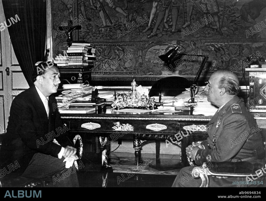 Surrealist Painter Salvador Dali (left) talks with Spanish Chief of State General Franco, during a visit to Franco at the El - Parado Palace, Madrid.. 8 June 1956.
