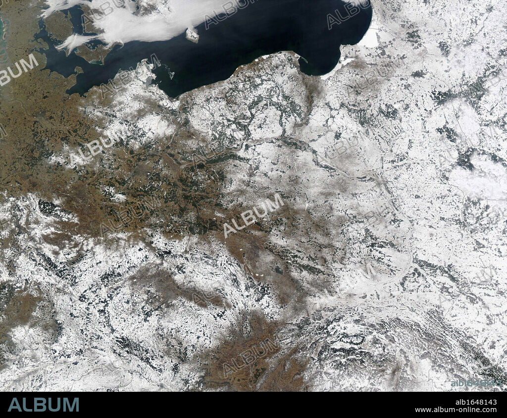 Snow over Poland and its neighbours. True-color Aqua MODIS image from February 25, 2003. MODIS also detected a number of fires in the scene, all of which are marked in red. Countries shown are (clockwise from top left) Denmark, Sweden, Lithuania, the Russi.