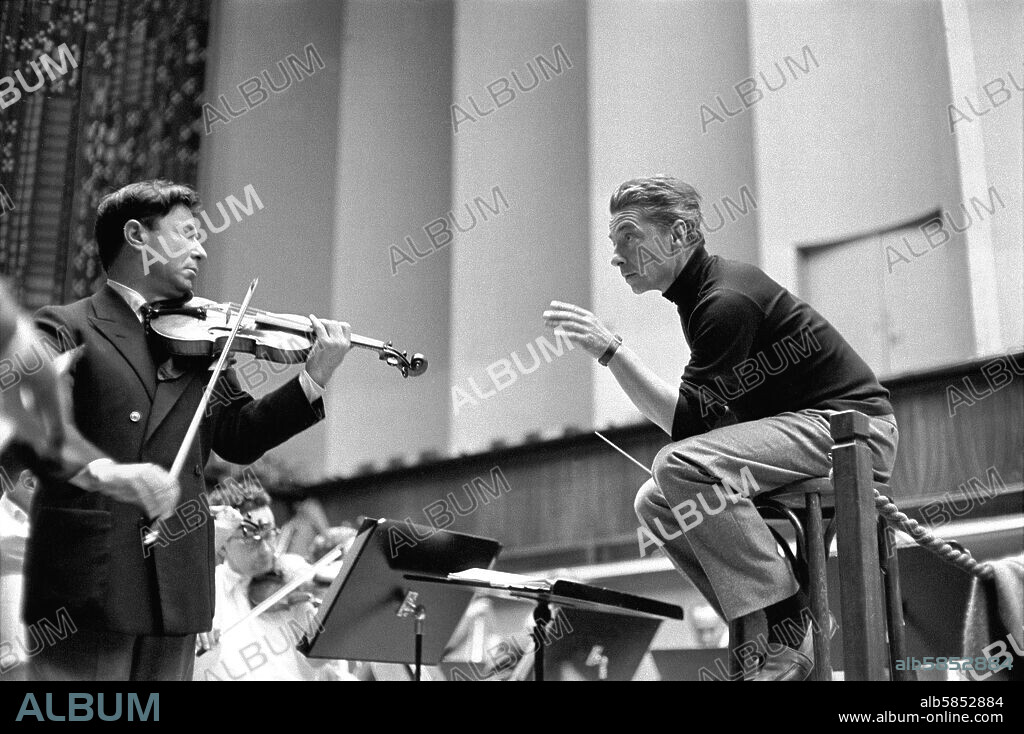 Conductor Herbert von Karajan rehearsing with Nathan Milstein in Lucerne, Switzerland. Lucerne,1957.