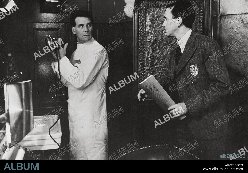JONATHAN PRYCE and MICHAEL PALIN in BRAZIL, 1985, directed by TERRY GILLIAM. Copyright 20TH CENTURY FOX.