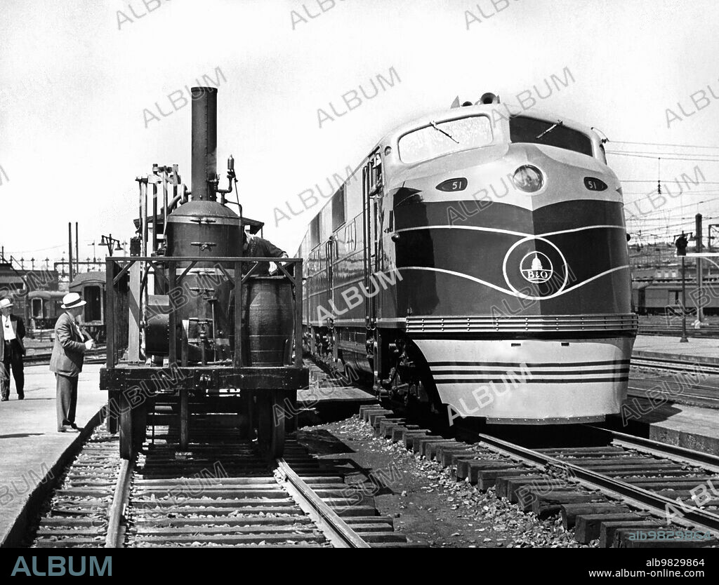 Washington DC, May 25, 1937, The oldest and newest trains are shown at Union Station. On the left is the Tom Thumb engine which went all of 10 mph when it was first used in 1829. Next to it is the Baltimore & Ohio Railroad's newest diesel engine which will pull the Capitol Limited Pullman train between Washington and Chicago at 75 mph.