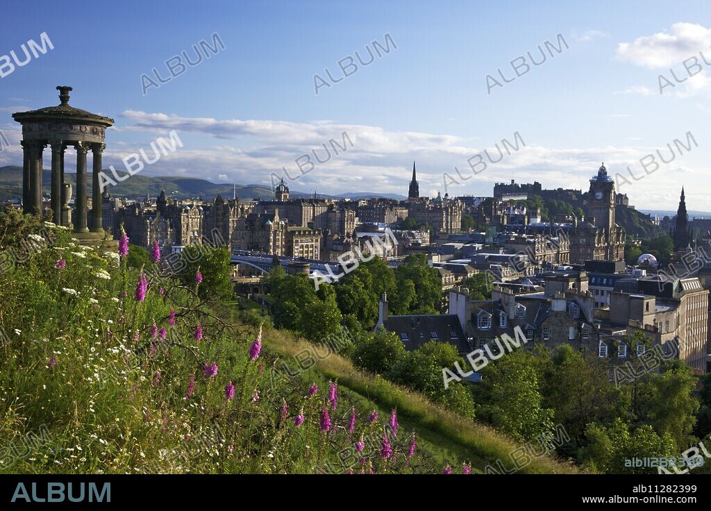 Dugald Stewart Monument and view of Old Town from Calton Hill in summer sunshine, Edinburgh, Scotland, United Kingdom, Europe.