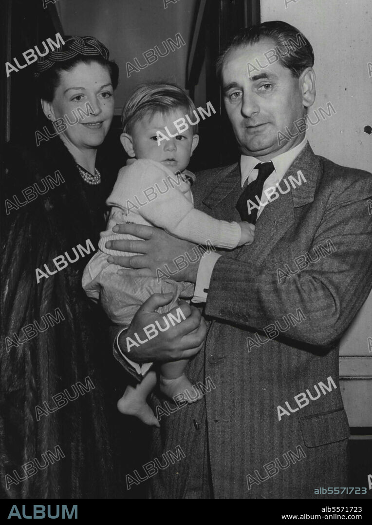 "Cruel Sea" Man Off To Ottawa -- Mr. Nicholas Monsarrat, author of that well-known novel "The Cruel Sea", and Director U.K. Information Bureau, photographed with his wife and 10 months-old son Mark, when they left Buston Station this morning for Ottawa. April 29, 1955.