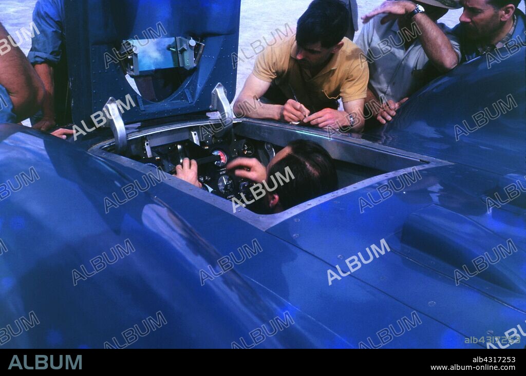 Donald Campbell in Bluebird CN7 cockpit at Lake Eyre 1963, Ken Norris on right.