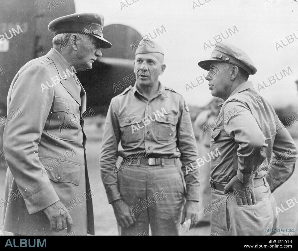 Somewhere In New Guinea -- Lieut. General William S. Knudsen (left) discusses war strategy with Major General Ennis C. Whitehead (center) deputy commander fifth air force, and Lieut. General George C. Kenney (right) commander of the fifth air force.Lieut. General Knudsen visited the island with under Secretary of war Robert P. Patterson during an inspection tour of the Southwest pacific. September 13, 1943. (Photo by Fifth U.S. Air Force Photo).