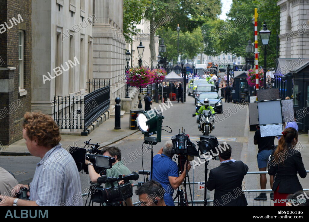 press gathered in Downing Street, London, the official residences and offices of the Prime Minister of the United Kingdom and the Chancellor of the Exchequer. Situated off Whitehall, a few minutes' walk from the Houses of Parliament, Downing Street was built in the 1680s by Sir George Downing.
