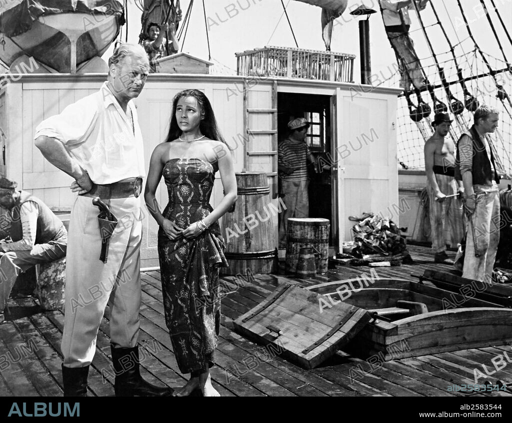CURD JüRGENS and DOROTHY DANDRIDGE in TAMANGO, 1958, directed by JOHN BERRY. Copyright FILMS DU CYCLOPE.