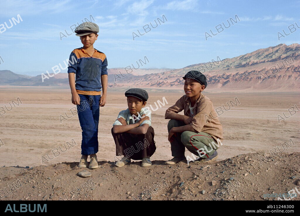 Portrait of three boys, Turpan, Xinjiang, China, Asia.