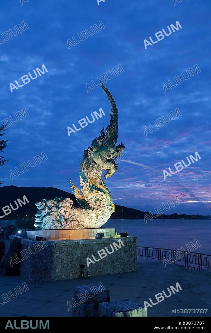 Dragon fountain at night on the promenade in Songkhla, Thailand, Asia.