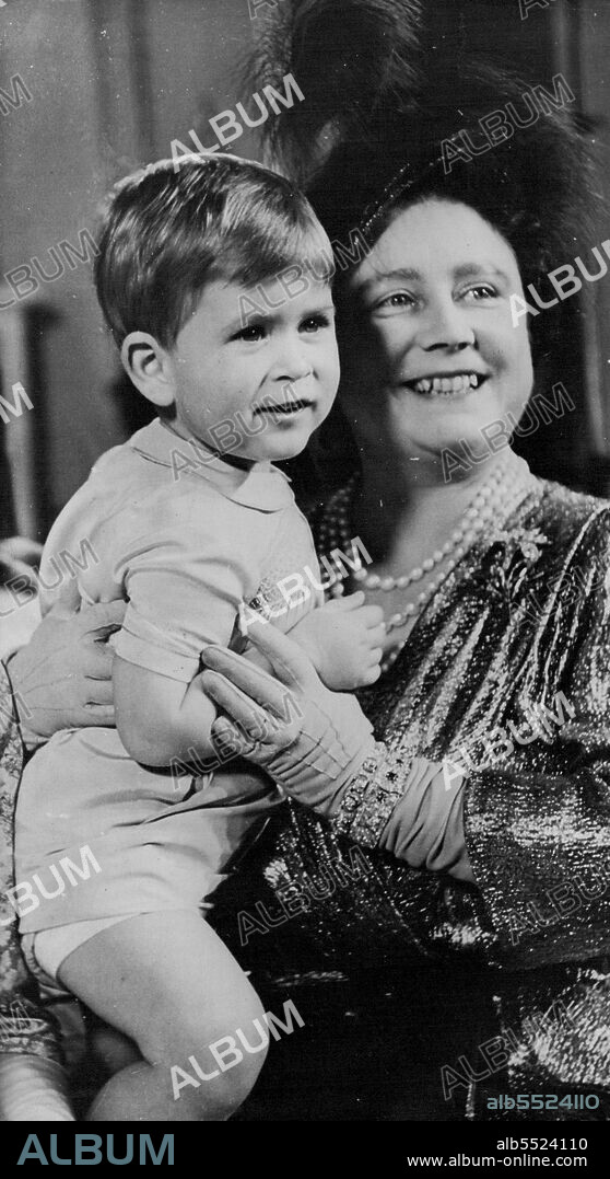 1950... The young Prince with Elizabeth now the Queen Mother. November 11, 1950. (Photo by The Associated Press Ltd.).