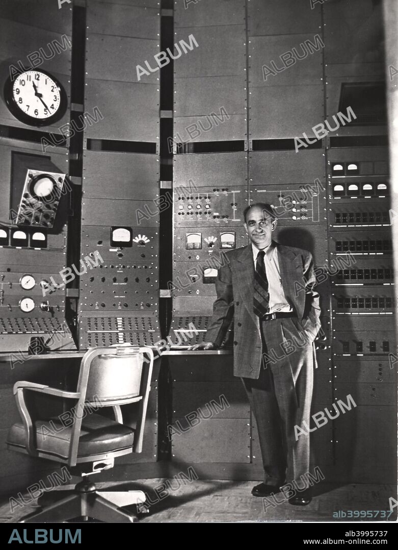 Enrico Fermi, Italian-born American nuclear physicist, c1942. Fermi (1901-1954) constructed the first working nuclear reactor, in a squash court at the University of Chicago in 1942. He won the Nobel prize for physics in 1938 for his demonstrations of the existence of new radioactive elements produced by neutron irradiation, and for his related discovery of nuclear reactions brought about by slow neutrons. Fermi is shown here in the control room of the Chicago synchro-cyclotron.