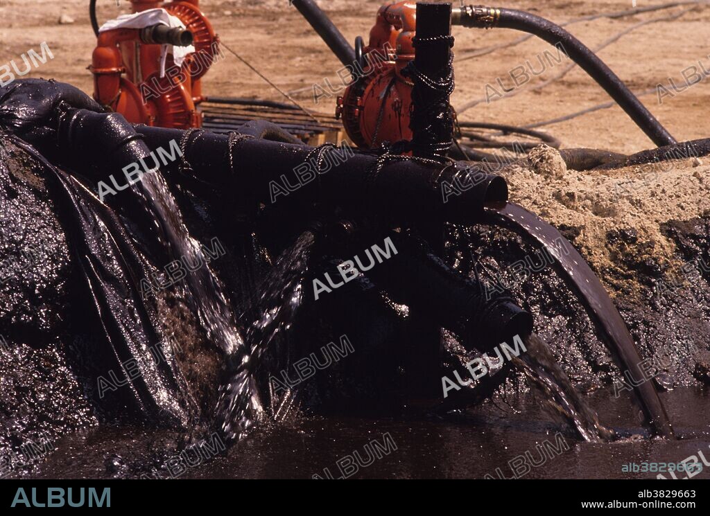 Kuwait; March, 1991. Pumps remove crude oil from areas contaminated during the 1991 Gulf War oil spill along the coastal areas of Kuwait. On January 23, 1991, Iraqi forces, upon orders from Saddam Husein, opened valves at an offshore terminal in Kuwait and dumped oil from several tankers into the Persian Gulf. The apparent strategic goal was to foil a potential landing by U.S. Marines during the invasion of Kuwait. The Gulf War oil spill is regarded as the worst oil spill in history, resulting from actions taken during the Gulf War in 1991. It caused considerable damage to wildlife in the Persian Gulf especially in areas surrounding Kuwait and Iraq. Estimates on the volume spilled range from 42 to 462 million gallons; the slick reached a maximum size of 100 by 40 miles and was 4 inches thick. Despite the uncertainty surrounding the size of the spill, figures place it 5 to 27 times the size (in gallons spilled) of the Exxon Valdez oil spill, and more than twice the size of the 1979 Ixtoc I blow-out in the Gulf of Mexico.