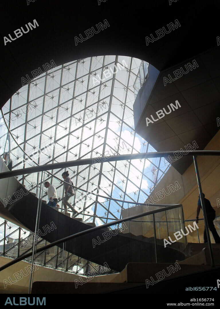 Interior of the 'Louvre Pyramid' at the Louvre museum, Paris France. Designed by I. M. Pei.