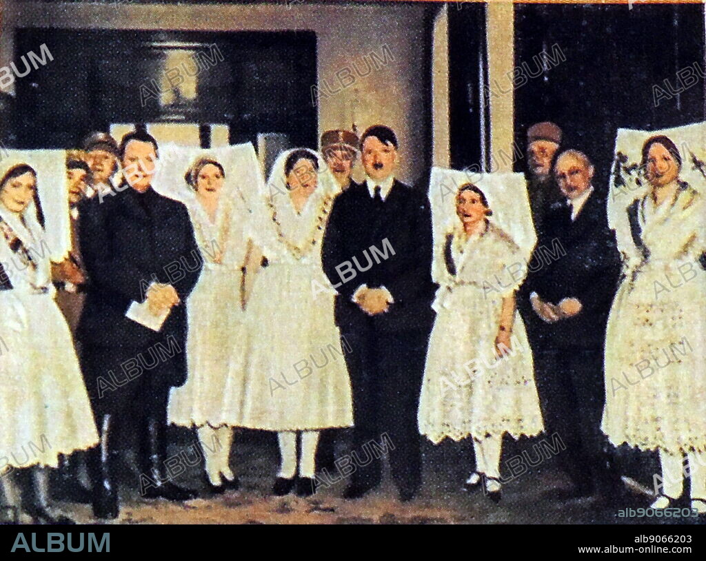 local women in traditional clothes meet adolf hitler and Herman Goring.