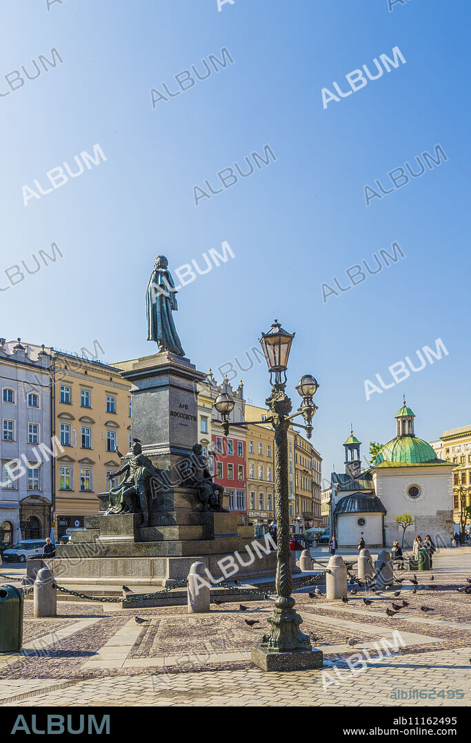 The Adam Mickiewicz Monument in the main Square in the medieval old town, UNESCO World Heritage Site, Krakow, Poland, Europe.
