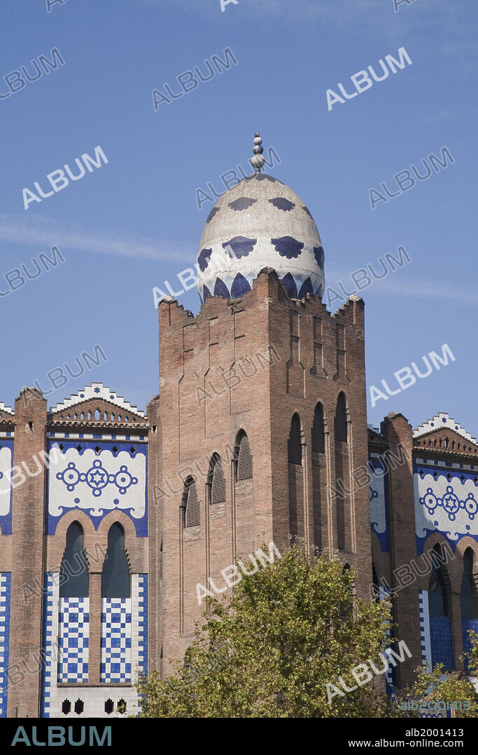 The Monumental Bullring of Barcelona, known as the "Plaza de Toros Monumental de Barcelona" ("La Monumental" for short), was designed by Ignasi Mas and Joaquim Raspall. It was inaugurated in 1915 with the first bullfights in this place. The building is made of brick and is crowned with four blue and white ceramic egg-like forms. Its style is a mixture of Mudejar (Moorish) and Byzantine. La Monumental houses "The Bullfighting Museum of Barcelona".