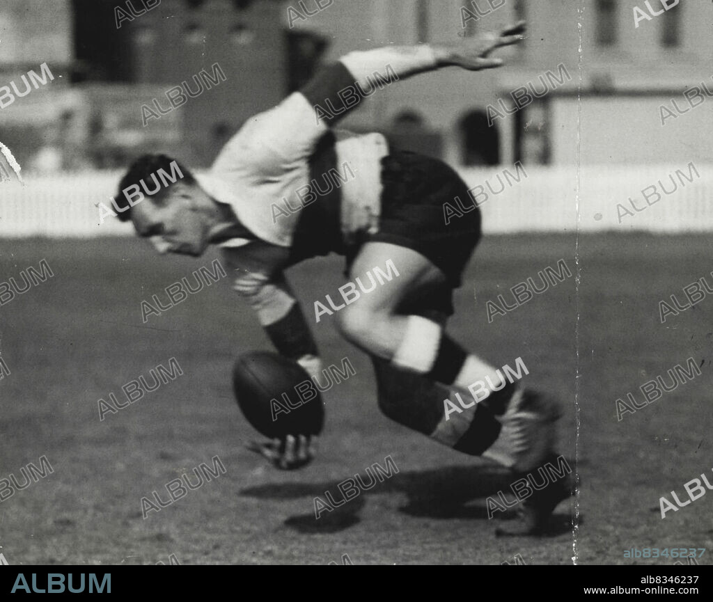 Veteran Gus Risman who pays a tribute to Norburn shows how a skilful winger should gather a rolling ball with one hand on the run. June 01, 1936.