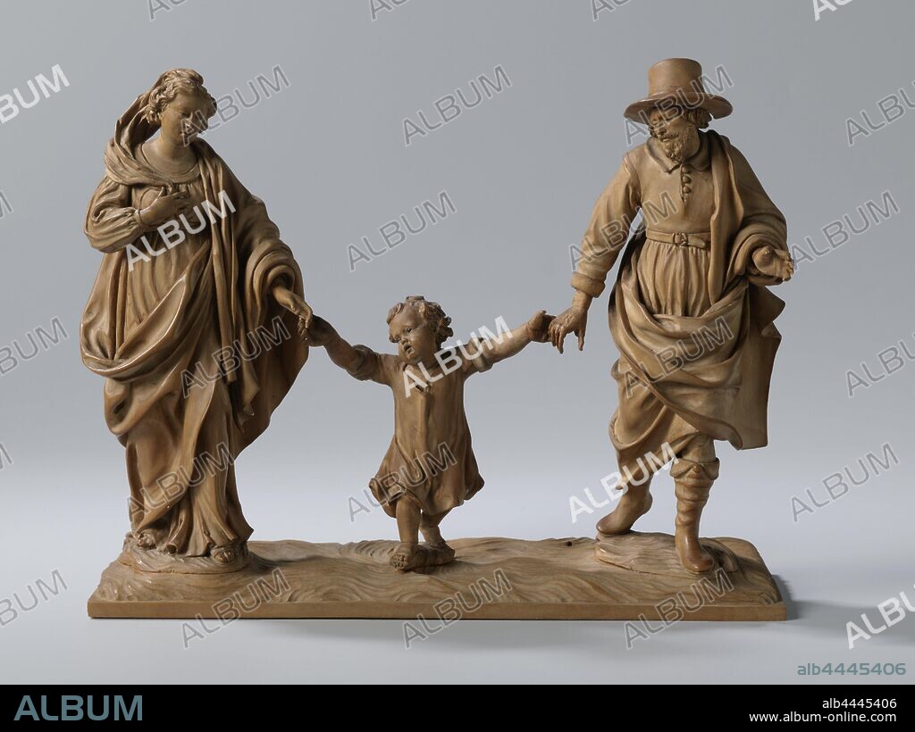 Holy Family, This group of statues of a father, mother and child, represents the Holy family. On a naturalistic background, Mary and Joseph walk side by side with their son between them. The couple is holding the hands of the Christ child to help him walk. They seem to be about to whip up the toddler playfully. Maria is wearing a robe with a belt high around the waist. She is walking on sandals and a headscarf has been incorporated into her braided hair. Joseph is wearing contemporary clothing, boots and a hat with a belt. He has put a cloak on his right shoulder. The Christ Child walks barefoot and wears a contemporary shirt with rolled up sleeves. The base and the three figures are cut separately, in addition, the arms and Joseph's hat are set loose. The eyes of the three figures are inlaid with black glass., Holy Family (alone), 'Trinitas terrestris', Jan van Doorne (III), Mechelen, c. 1640 - c. 1650, boxwood, ogen, cutting, h 16.3 cm × w 20.6 cm × d 6.5 cm.