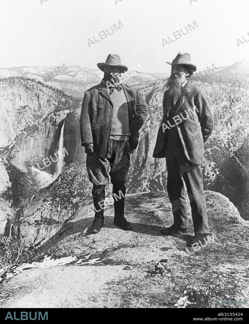 Yosemite National Park, California:  1903 Theodore Roosevelt and John Muir standing on Glacier Point overlooking the Yosemite Valley below.
