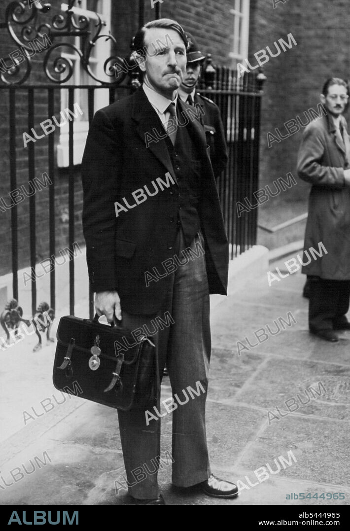 Cabinet Meets On Abadan Crisis -- Solicitor General Sir Frank Soskice photographed looking solemn as he leaves No. 10 Downing Street after the Cabinet Meeting. The cabinet met this morning at No. 10 Downing Street to discuss the serious situation which has arison following the order by Persian Premier Mossadeg to blow up all the Abadan oil installations if foreign troops try to land in the country. September 27, 1951. (Photo by Fox Photos).
