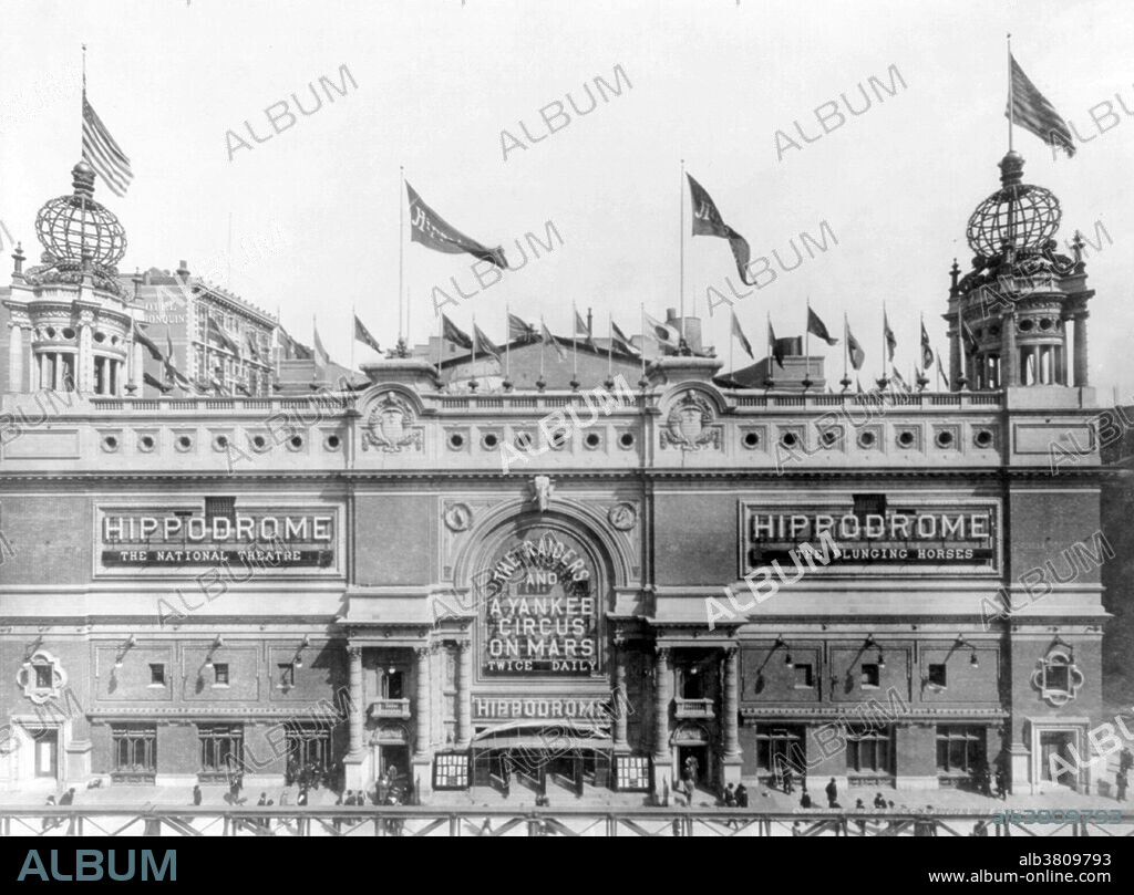 The Hippodrome Theatre was a theater in NYC from 1905-39, located on Sixth Avenue between West 43rd and West 44th Streets in the Theater District of Midtown Manhattan. It was called the world's largest theatre by its builders and had a seating capacity of 5,300, with a 100x200 foot stage. The theatre had state-of-the-art theatrical technology, including a rising glass water tank. The Hippodrome was built by Frederick Thompson and Elmer Dundy, creators of the Luna Park amusement park at Coney Island, with the backing of Harry S. Black's U.S. Realty, a dominant real estate and construction company of the time. The exterior of the red-brick and terra-cotta building was Moorish in style, with two corner towers, each of which was topped by a globe covered in electric lights. The Hippodrome's huge running costs made it a perennial financial failure, and a series of producers tried and failed to make money from the theatre. It was demolished in 1939. Photographed by C.C. Langill, 1905.