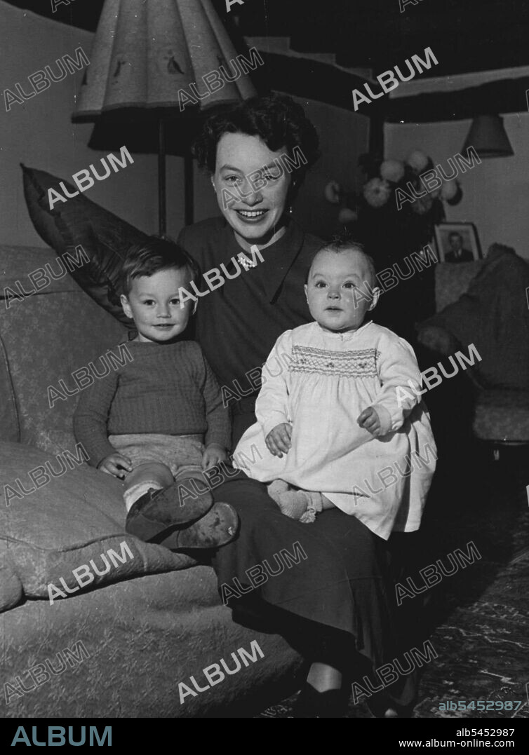 Money Puzzles Them On This Island -- Mrs. Botha with son Gough and baby Jennifer.When young Mr. and Mrs. Botha opened a general stores, everyone flocked to buy - for there wasn't another shop for 1,500 miles around. And not only were most of the customers experiencing their first shopping thrill many of them were spending money for the first time. For in lonely Tristan da Cunha, Britain's dot of a colony in the gale-swept South Atlantic, money didn't Company arrived to set up a local crayfish industry.Even if they'd had money, there would have been nowhere to spend it on the island, where people paid for work down with three meals a day. November 22, 1950.