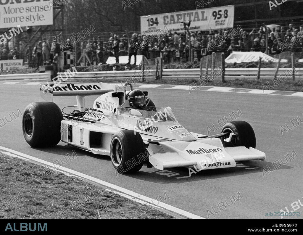 James Hunt in McLaren-Ford M23, Brands Hatch, Kent, 1977. Formula 1 World Champion James Hunt in action during the Race of Champions in 1977. Hunt won the race and set a new lap record for the 4.2 kilometre (2.1 mile) circuit at 190.9 kph (118.38 mph). The charismatic British driver won 10 Grands Prix after suffering with uncompetitive cars early in his career, and in 1976 secured the World Drivers' Championship. He retired after the 1979 Monaco Grand Prix, and was best remembered afterwards for his partnership with Murray Walker in the BBC Grand Prix commentary box. James Hunt died in 1993 of a massive heart attack, aged only 45.