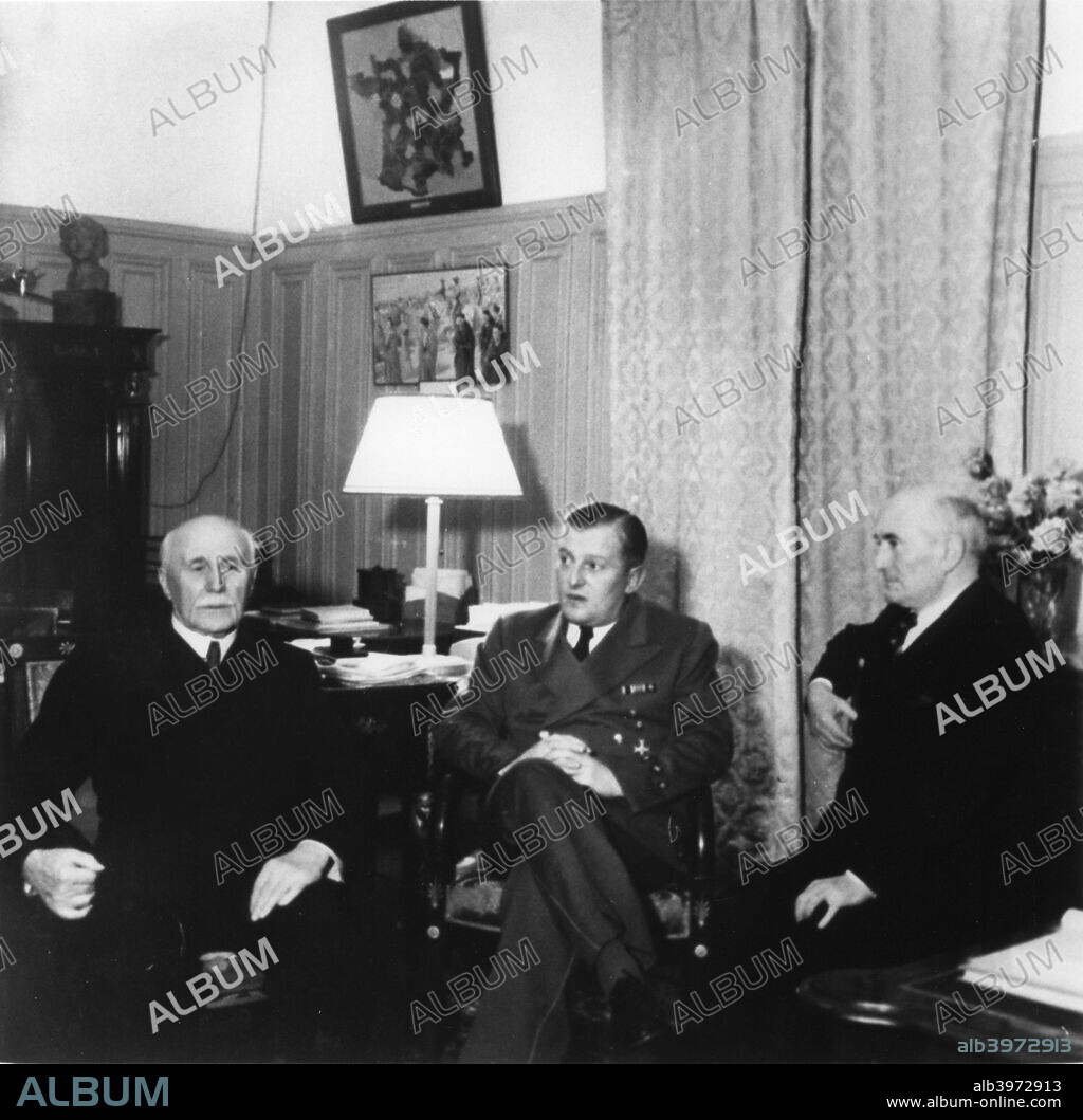 Leaders of Vichy France, c1940-1942. Marshal Philippe Petain (left), Head of Stae of the Vichy regime established after the defeat of France in June 1940, together with Admiral Francois Darlan (right), his deputy from February 1941 until November 1942. The two and the third, unidentified, man are meeting after having received the German ambassador, Otto Abetz.